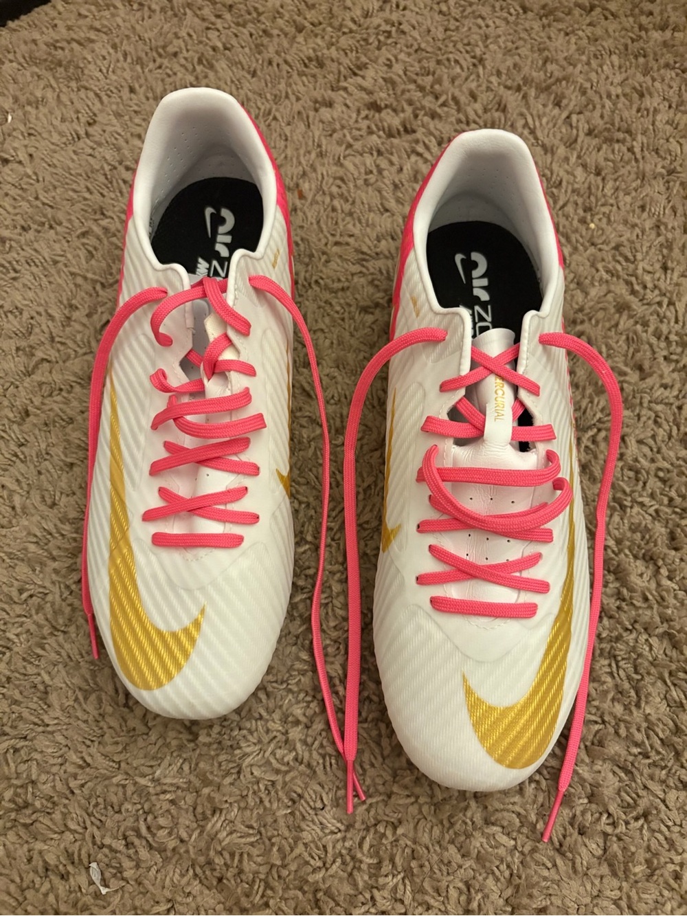 Nike Women’s White & Pink soccer shoes with Gold Swoosh